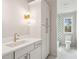 Stylish bathroom boasts a white vanity with modern fixtures and decorative sconces at 806 Jungle Rd, Edisto Island, SC 29438