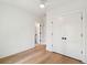 Bedroom featuring hardwood floors, double closets, and ensuite access at 806 Jungle Rd, Edisto Island, SC 29438