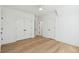 Bright bedroom featuring hardwood floors and large double door closets at 806 Jungle Rd, Edisto Island, SC 29438