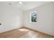 Bedroom with hardwood floors, ceiling fan, and a large window with nice view at 806 Jungle Rd, Edisto Island, SC 29438