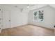 Bright bedroom featuring hardwood floors, a ceiling fan, and a window with a view at 806 Jungle Rd, Edisto Island, SC 29438