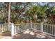 Elevated wooden deck showcases the home's idyllic surroundings and outdoor living spaces at 806 Jungle Rd, Edisto Island, SC 29438