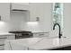 Modern kitchen featuring sleek white cabinets, stainless steel appliances and countertops at 806 Jungle Rd, Edisto Island, SC 29438