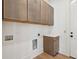 Laundry room features wooden cabinets and countertop space at 806 Jungle Rd, Edisto Island, SC 29438