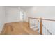 Bright living room features hardwood floors, open floor plan, and staircase at 806 Jungle Rd, Edisto Island, SC 29438