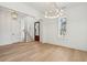 Bright living room with hardwood floors, modern lighting, and a staircase at 806 Jungle Rd, Edisto Island, SC 29438