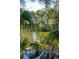 Backyard featuring a pond with trees at 806 Jungle Rd, Edisto Island, SC 29438