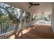 Expansive porch with wooden flooring and multiple ceiling fans at 806 Jungle Rd, Edisto Island, SC 29438