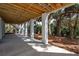 View of the underneath of the home with support columns and greenery at 806 Jungle Rd, Edisto Island, SC 29438