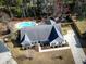 Aerial view of a home with pool, fenced yard, driveway, and landscaped front yard at 8209 Governors Walk, North Charleston, SC 29418