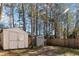 Spacious backyard features two storage sheds and a wooden fence, offering practical storage solutions at 8209 Governors Walk, North Charleston, SC 29418