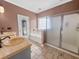 The bathroom has dual sinks, tiled floors, and a separate tub and shower at 8209 Governors Walk, North Charleston, SC 29418