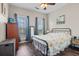 This bedroom boasts lots of light, dark wood flooring, and a unique style at 8209 Governors Walk, North Charleston, SC 29418