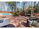 Relaxing outdoor deck with pergola, seating, and pool view, perfect for enjoying serene moments at 8209 Governors Walk, North Charleston, SC 29418