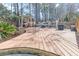 Spacious wooden deck features a pergola and seating area, perfect for outdoor gatherings and relaxation at 8209 Governors Walk, North Charleston, SC 29418