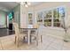 Cozy breakfast nook bathed in natural light connects the living area and kitchen at 8209 Governors Walk, North Charleston, SC 29418