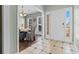 Bright entryway with tiled floor, leading to a dining area with table and chairs at 8209 Governors Walk, North Charleston, SC 29418