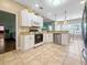 Functional kitchen with modern appliances, tiled flooring, and access to the adjacent living spaces at 8209 Governors Walk, North Charleston, SC 29418