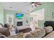 Inviting living room with fireplace, comfortable seating, and seamless flow to dining area at 8209 Governors Walk, North Charleston, SC 29418