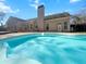 Backyard pool with attached deck area and view of home exterior at 8209 Governors Walk, North Charleston, SC 29418