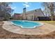 Backyard swimming pool with patio and a backdrop of a well-maintained house, creating a refreshing outdoor oasis at 8209 Governors Walk, North Charleston, SC 29418