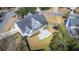 Aerial view of the property showcasing the deck, fenced backyard, trampoline, and landscaping at 8696 Spring Chapel Ln, North Charleston, SC 29420