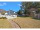 Backyard with a deck, pavers, and fencing, offering privacy and outdoor enjoyment at 8696 Spring Chapel Ln, North Charleston, SC 29420