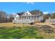 Expansive backyard with a deck, screened porch, and ample green space for recreation at 8696 Spring Chapel Ln, North Charleston, SC 29420