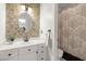 Updated bathroom with white vanity, tile backsplash, and shower with curtain at 8696 Spring Chapel Ln, North Charleston, SC 29420