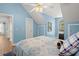 Bedroom with sloped ceilings and cozy decor with a patterned bed at 8696 Spring Chapel Ln, North Charleston, SC 29420