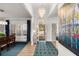 Inviting foyer with hardwood floors, a chandelier, and views of the front porch at 8696 Spring Chapel Ln, North Charleston, SC 29420