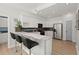 Modern kitchen featuring granite counters, white cabinetry, stainless steel appliances, and a breakfast bar at 8696 Spring Chapel Ln, North Charleston, SC 29420