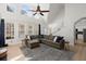 Bright living room with lots of natural light, high ceilings, and modern staircase at 8696 Spring Chapel Ln, North Charleston, SC 29420
