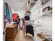 Large walk-in closet with built-in shelving, a dresser, and wood-look floors at 8696 Spring Chapel Ln, North Charleston, SC 29420