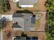 An aerial view of the house shows the backyard with a patio area and well-maintained landscaping at 9021 Robins Nest Way, Summerville, SC 29485
