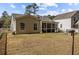 Backyard featuring a covered porch, a stone patio, a fenced backyard, and mature trees at 9021 Robins Nest Way, Summerville, SC 29485