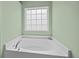 Corner soaking tub with bright window at 9021 Robins Nest Way, Summerville, SC 29485