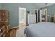 Bedroom featuring en suite bathroom, walk-in closet and view into kitchen at 9021 Robins Nest Way, Summerville, SC 29485