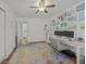 Inspiring bedroom featuring desk space, neutral colors, wood floors and wall art at 9021 Robins Nest Way, Summerville, SC 29485