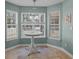 Bright breakfast nook with large windows and a view of the backyard at 9021 Robins Nest Way, Summerville, SC 29485