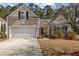 Charming home featuring a one car garage, American flag, neutral siding and well-maintained landscaping at 9021 Robins Nest Way, Summerville, SC 29485