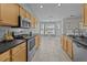 Modern kitchen has stainless appliances and a eat-in breakfast nook at 9021 Robins Nest Way, Summerville, SC 29485