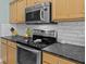 Stainless steel appliances with countertop cooking range, and stainless steel overhead microwave at 9021 Robins Nest Way, Summerville, SC 29485