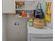 The laundry room area has storage shelves over the washing machine at 9021 Robins Nest Way, Summerville, SC 29485