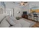 Comfortable living room with an open floor plan, ceiling fan, and access to the kitchen at 9021 Robins Nest Way, Summerville, SC 29485