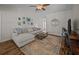 Cozy living room with a ceiling fan, decorative rug, and comfortable sectional sofa at 9021 Robins Nest Way, Summerville, SC 29485
