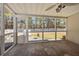 View of a screened in porch featuring white walls, a ceiling fan, and view of the backyard at 9021 Robins Nest Way, Summerville, SC 29485