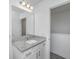 Bathroom featuring granite countertops, a white vanity, and a mirror at 9207 Bowen Corner Ave, Hanahan, SC 29410