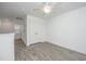 Spacious bedroom with a ceiling fan, light grey floors, and a closet with mirrored doors at 9207 Bowen Corner Ave, Hanahan, SC 29410