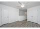 Spacious bedroom with a ceiling fan, light grey floors, and a closet with mirrored doors at 9207 Bowen Corner Ave, Hanahan, SC 29410